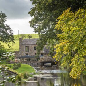 Exterior view of the mill pond and the mill as part of a grade II Mill Renovation
