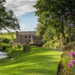 Exterior shot of the gardens and the mill as part of a grade II Mill Renovation