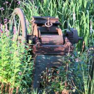 Original mill threshing machine as a garden feature