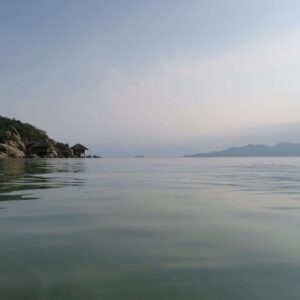 Salutogenic design vista of the sea, rocky outcrop and small wooden structure on stilts