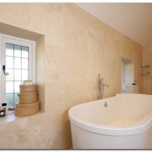 Master ensuite with full tiling, large white bath and wet room designed shower