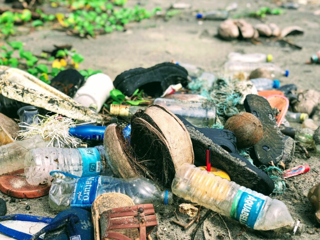 A pile of waste include plastic bottles and old footwear