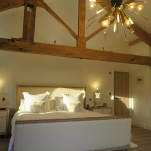 Master bedroom with emperor bed and large oak truss