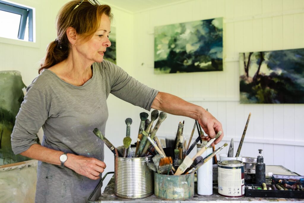 Joanna Farrow painting in her studio