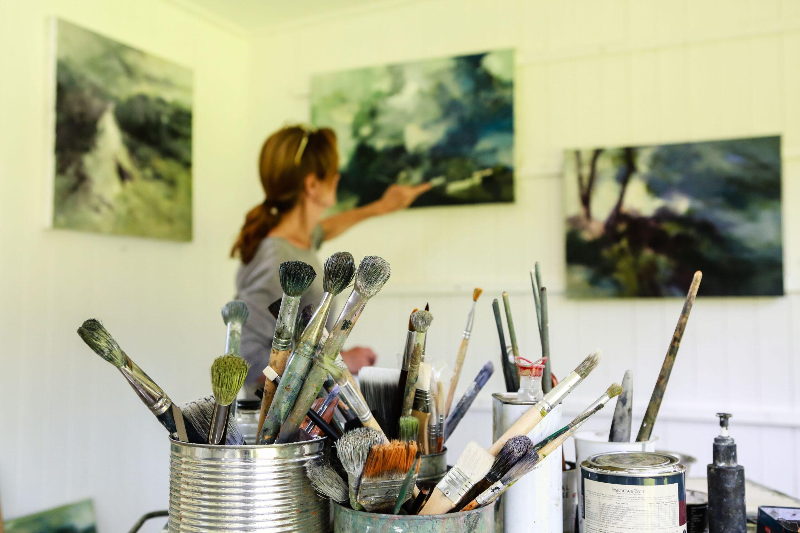 Joanna Farrow painting in her studio