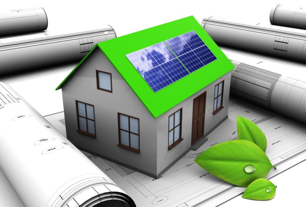 Architects grey model of a house with a green roof with solar panels on it
