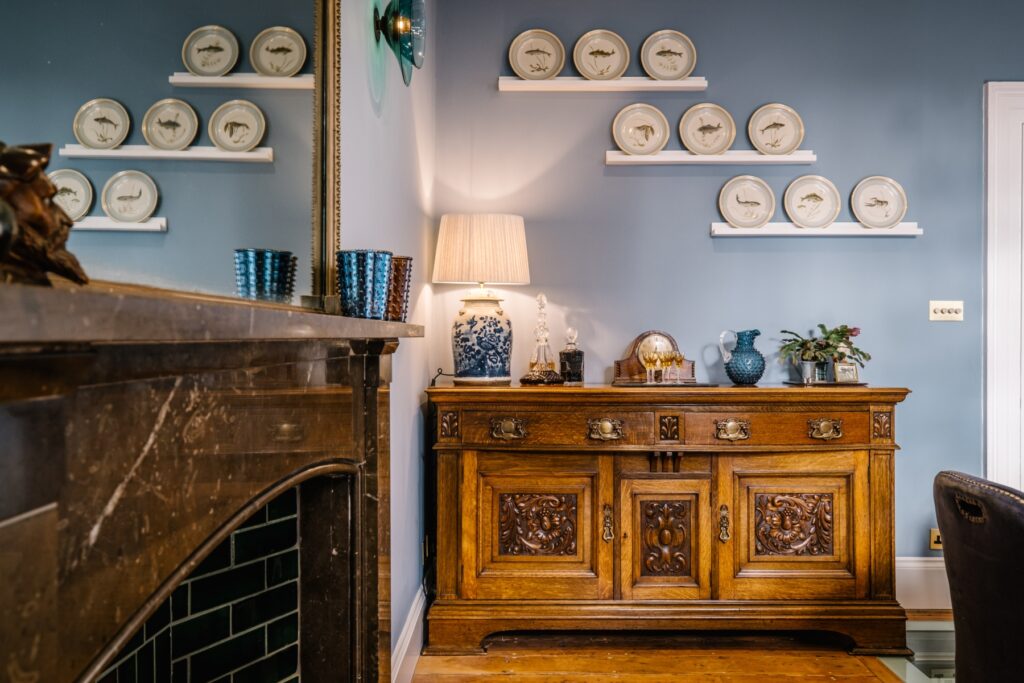 Antique dining room side table with drawers and cupboards