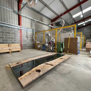 Fabrication of resin and wild walnut to create a bespoke river resin dining table.