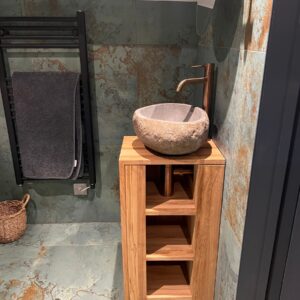Small ensuite with a free standing wash unit, verdigris wall tiles and natural stone bowl