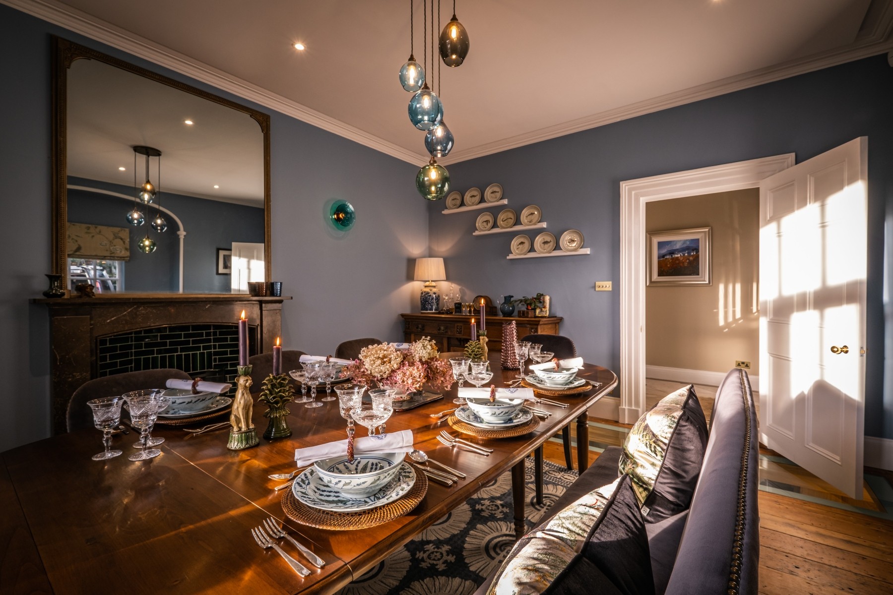 Dining room renovation with rich deep colours, handmade furniture and formally set