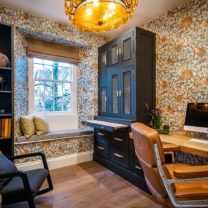 Bespoke study furniture with juxtaposition metal handles, animal wallpaper and view outside