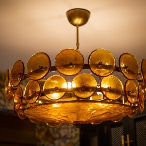 Close up of a circular glass pendant with lots of circular discs