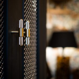 Close up on the metal handles of bespoke study furniture