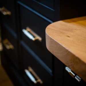 Close up of the bespoke study desk with juxtaposition metal handles