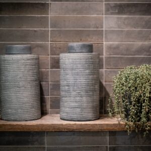 Close up of ginger jars and an indoor plant in a Luxury ensuite bathroom