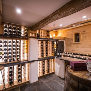 Bespoke wine cellar with oak panelling, whisky barrel and led lighting