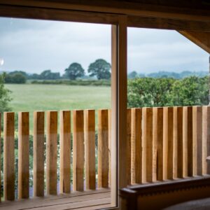 View out to the balcony with oak post railings