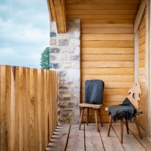 Outside seating on balcony with reclaimed oak boards and oak post railings