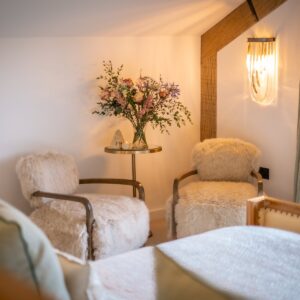 Seating area with two seats in the corner of the master bedroom