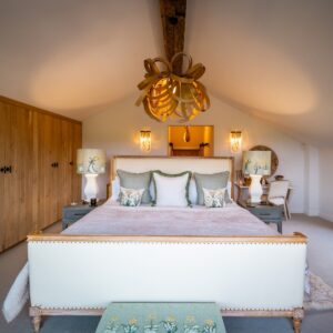 Nature and Spring design inspired master bedroom with emperor bed, bespoke cabinetry, handmade applique lamps and oak bent pendant light