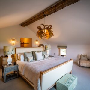Nature and Spring design inspired master bedroom with natural carpet and seating area
