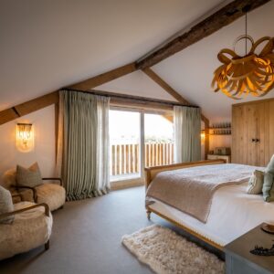 Nature and Spring design inspired master bedroom with natural carpet, bespoke cabinetry and handmade applique lamps