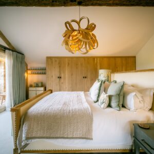 Nature and Spring design inspired master bedroom with emperor bed and oak bent pendant light