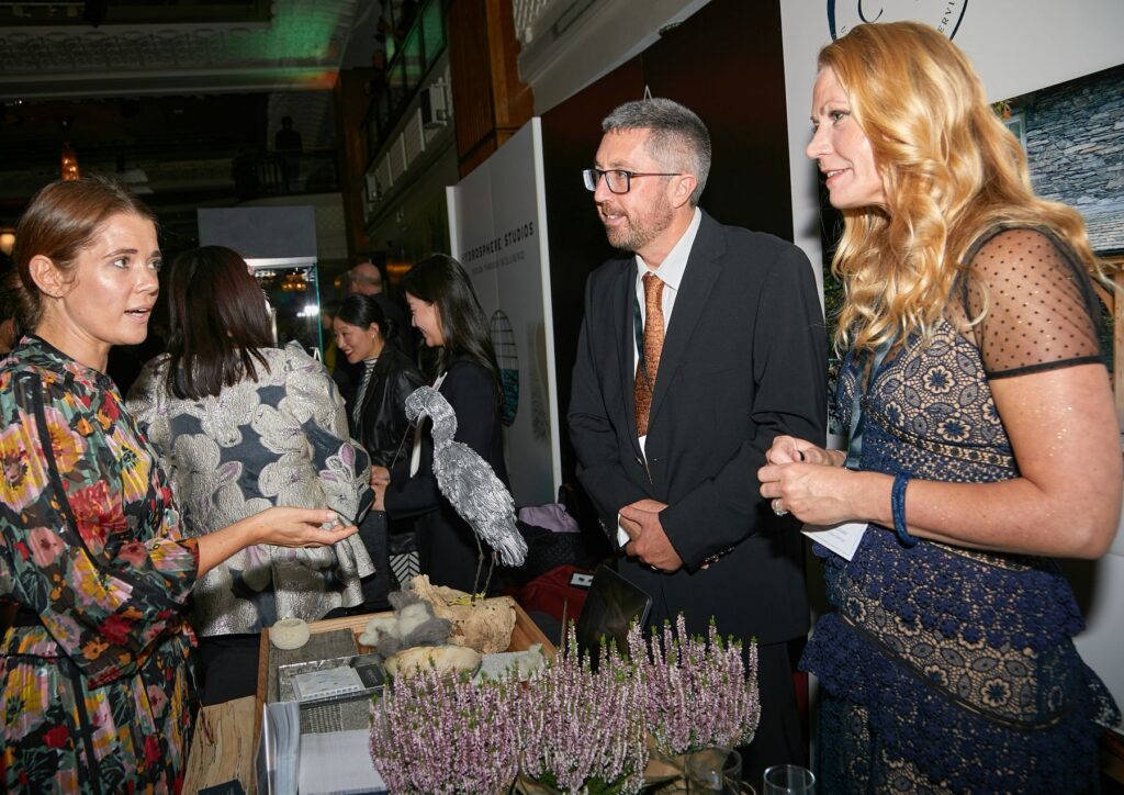 Charlotte Findlater and Scott Findlater talking with a Rolls Royce car club member about sustainable architecture, build and interior design.