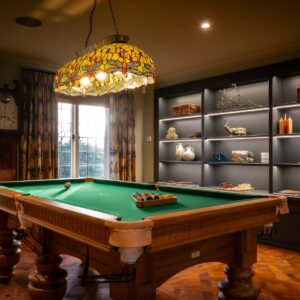 Luxury games room with bespoke Oak pool table and bespoke built in cabinetry