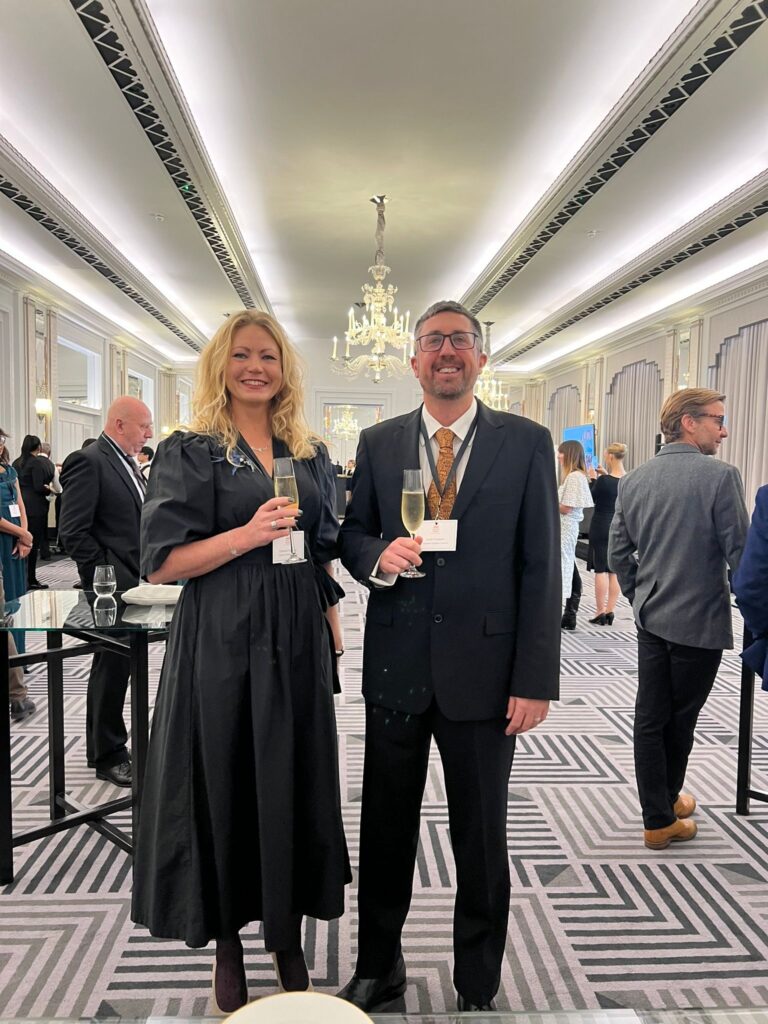 Charlotte Findlater and Scott Findlater with champagne glasses at His Majesty King Charles III at 75: The Leadership and Vision of King Charles III, at Claridge’s in central London on His Majesty’s 75th birthday.