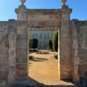 An renovated stone gate leading to a courtyard