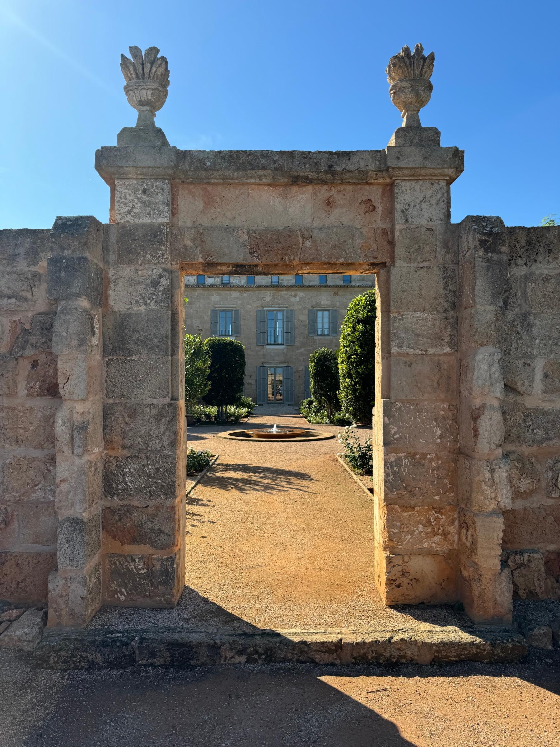 An renovated stone gate leading to a courtyard