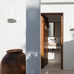 A glimpse of the hand carved stone sink of the outside loo