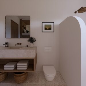 Minimalist 3D render of a Menorcan villa bathroom with a floating timber vanity and stone basin, brass wall tap, wall-hung toilet, framed artwork, and an arched shower screen with rainfall shower head.