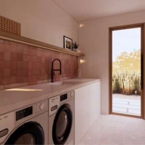 Sunlit 3D render of a Menorcan villa utility room with a terracotta tile splashback, stone worktop with sink and black tap, integrated laundry appliances, woven storage baskets, and a glazed door opening to an outdoor path with planting.