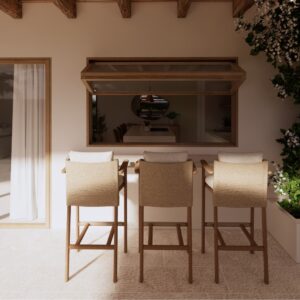 Sunlit 3D render set within a Menorcan villa, showing three woven bar stools at an outdoor pass-through counter beneath a timber awning window, with sliding glass doors to the left and a rough stone wall with climbing greenery and planter to the right.